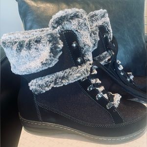 Women’s waterproof fur-lined boots; like new condition.